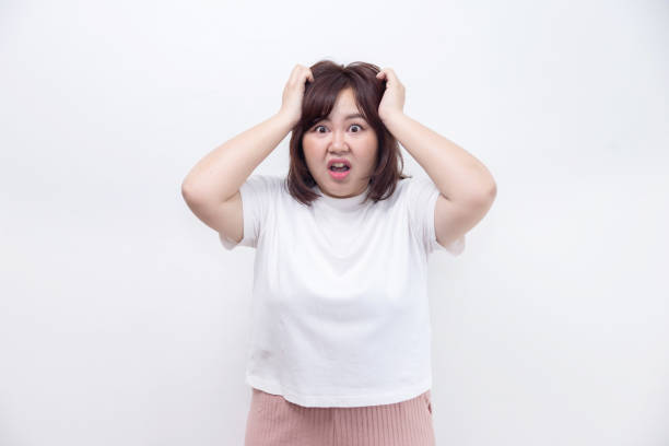 istock Chubby Asian Woman Grab Her Head Upset Feeling 1426977101