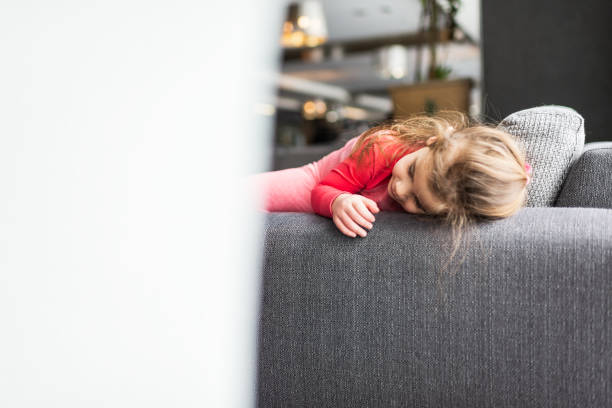istock Beautiful girl relaxing on a sofa 1426984485