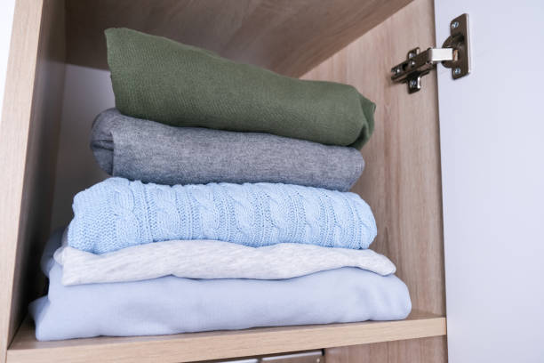 istock A stack of organized clothes on a shelf in a wardrobe 1426984514