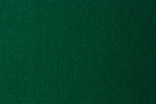 istock Green color felt textile fabric material texture background. Abstract monochrome dark blue color felt background 1426985299