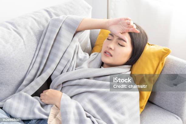 Asian Woman Touch Her Forehead From Flu Headache Stock Photo - Download Image Now - 25-29 Years, Adult, Adults Only