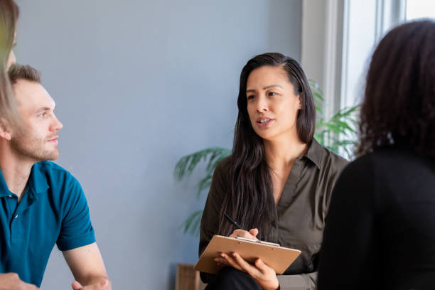 istock Mature counselor leads group therapy meeting with diverse adults 1426990500