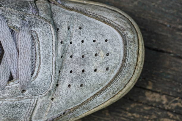 istock part of one white dirty leather sneaker 1426992306