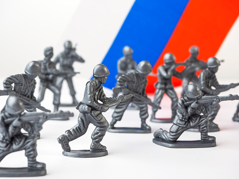 Close up of child toy, kids toy, small plastic toy, plastic toy man, plastic toy soldier isolated on white background.