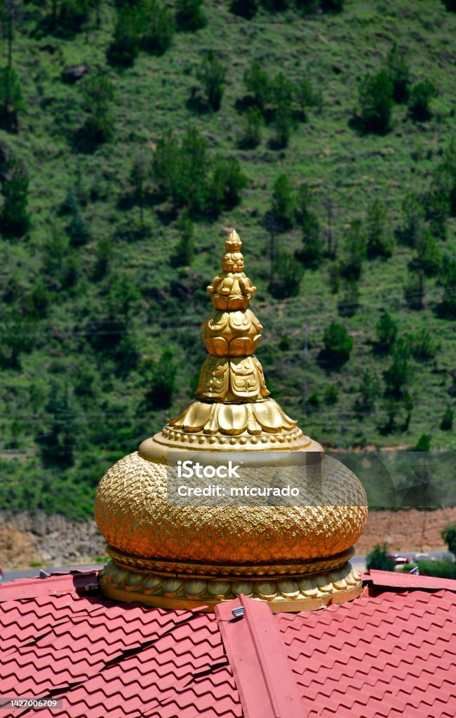 Finial of the Durga Mandir Hindu Temple, Thimphu, Bhutan Thimphu, Bhutan: Durga Mandir - the koil's golden finial with lotus on a red roof - Hinduism is the second largest religious affiliation in Bhutan, covering about 23% of the population, it is followed mainly by the ethnic Lhotshampa - 'Durga' means impassable, invincible, unassailable - Changbangdu area. Appendix Stock Photo