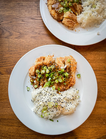 Fried rice chicken, a typical inexpensive food for travelers in South-East Asia. The photo taken in Kampot, Cambodia, 1.5$ for a dish at an open air restaurant of local hygiene standards.