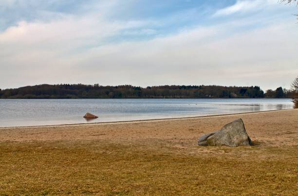 istock Beautiful landscape at a lake with a reflective water surface 1427014492