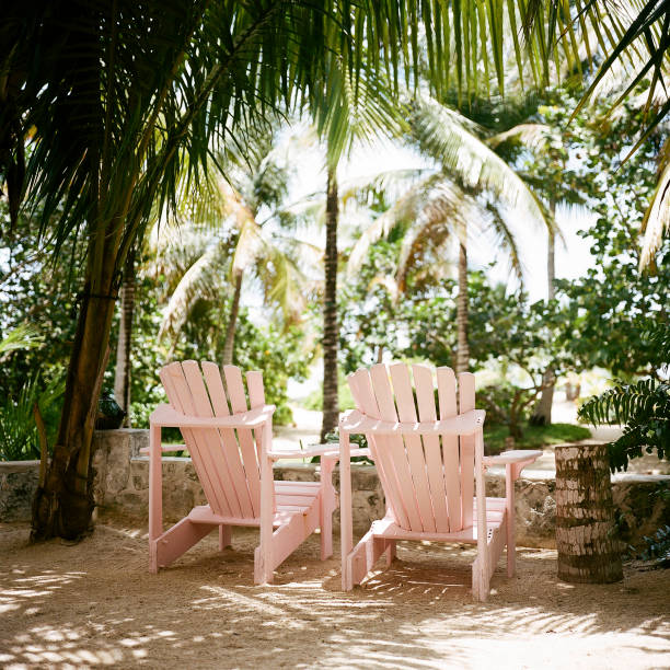 Andros, Bahamas; June 15, 2016; Pink chairs between the dining area at Kamalame Cay Resort and the beach at Kamalame Cay, Andros, Bahamas