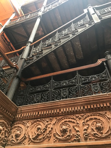 Ornate iron work of iron stairs in Bradbury building downtown Los Angeles California