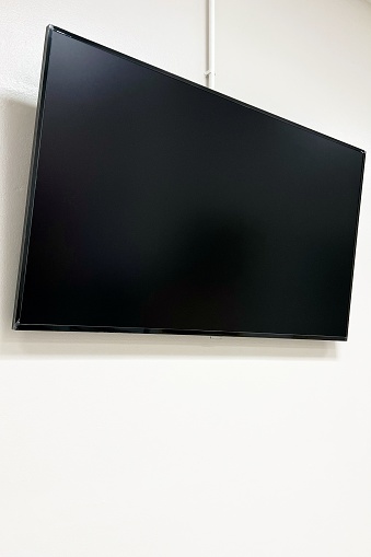 Close-up TV on white wall