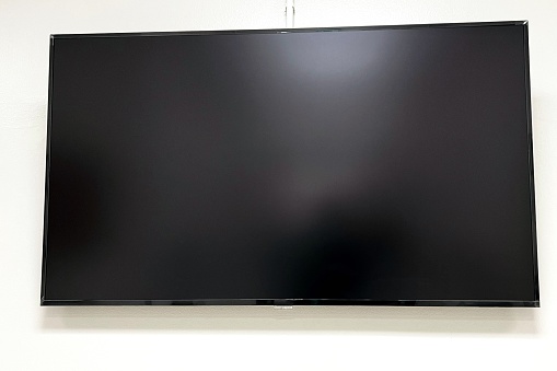 Close-up TV on white wall