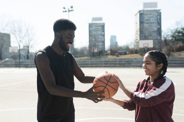 istock Afro man and his girlfriend playing basketball 1427038486