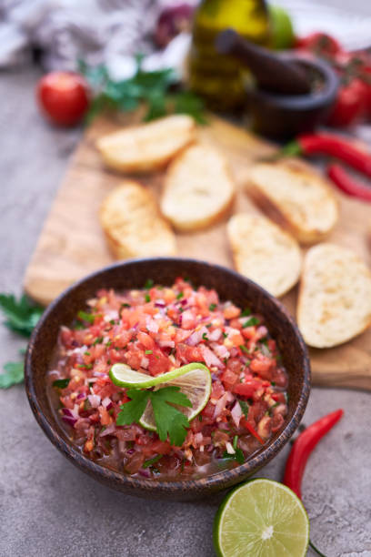 istock Making bruschetta with freshly made salsa dip sauce 1427039063