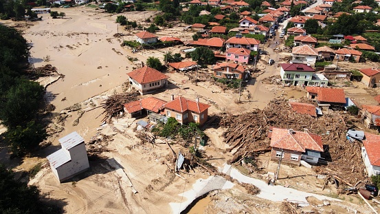 Village covered with mud after major flood, seen from above.