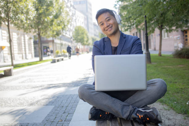 istock Young student learning online outdoors 1427040502