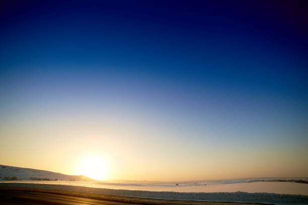 winter sunset on a background of snowy mountains.
