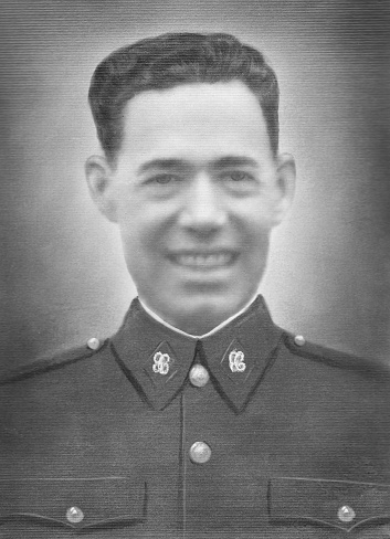 A Marine stands in his dress blue uniform