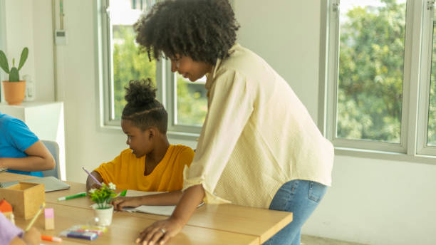 istock Young happy kids enjoy study with friends 1427056166