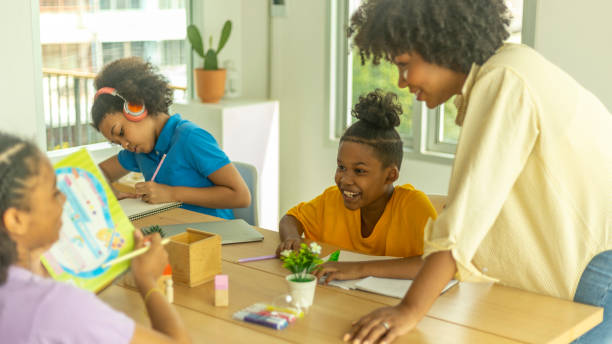 istock Young happy kids enjoy study with friends 1427056175