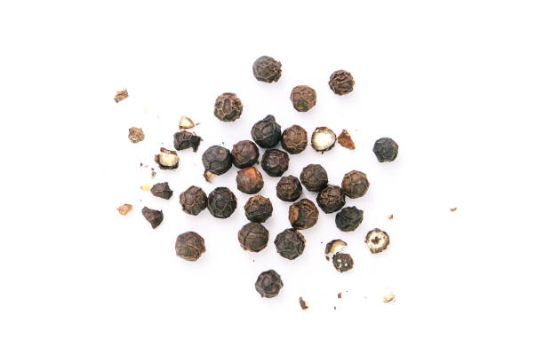 istock Dry black pepper Black pepper or peppercorns with broken isolated on white background. 1427058041