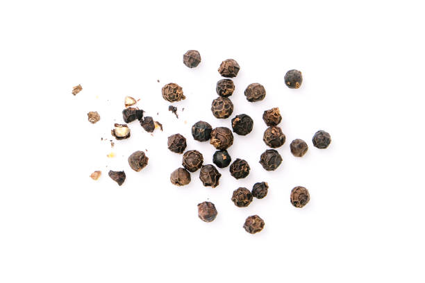 istock Dry black pepper Black pepper or peppercorns with broken isolated on white background. 1427058046