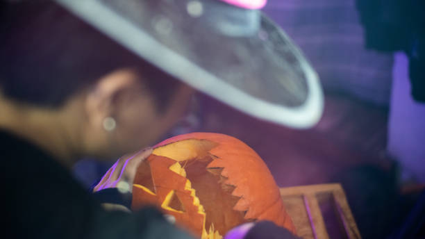 istock Girl making a halloween pumpkin 1427059854
