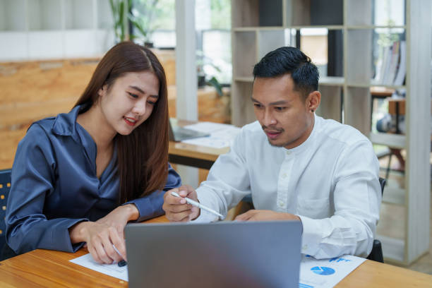 istock startup business, portrait of two entrepreneurs using computers and financial budget documents to make marketing plans to increase profits 1427060430