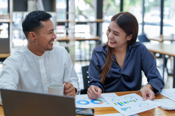 istock startup business, portrait of two entrepreneurs using computers and financial budget documents to make marketing plans to increase profits 1427061505