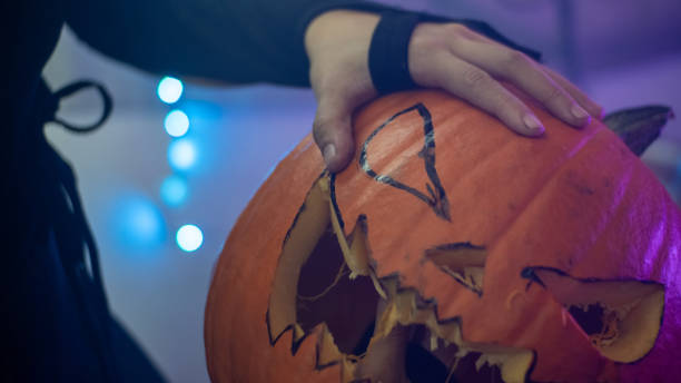 istock Girl making a halloween pumpkin 1427061873