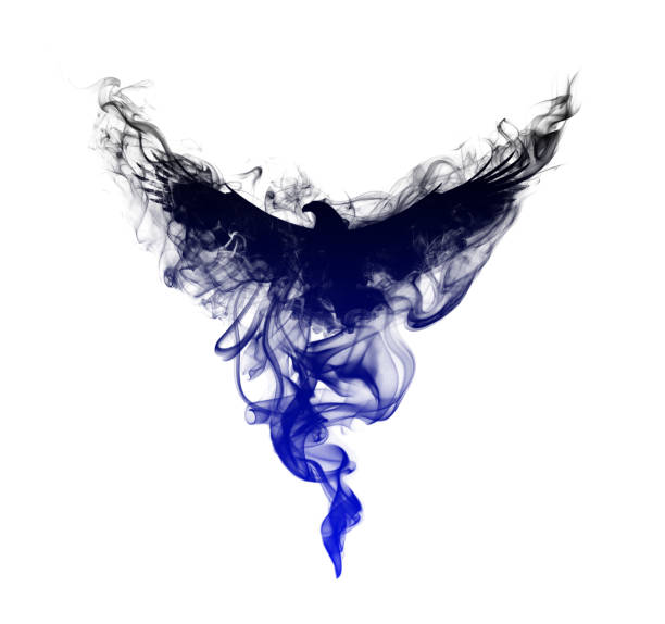 Silhouette of a flying eagle with spread wings in beautiful puffs of smoke isolated on a white background. Silhouette of a flying eagle in clouds of smoke with a beautiful gradient. stock photo