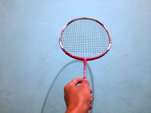 istock someone's hand is holding a badminton racket 1427088278