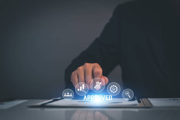istock Business approved concept. Manager hand stamping with approved stamp on certificate document public paper, investment certificate, business document, certificate approved, investment allowed. 1427093171
