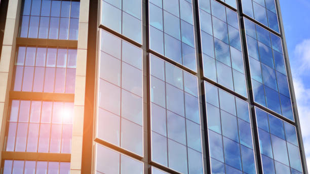 istock Modern glass facade against blue sky. 1427093706
