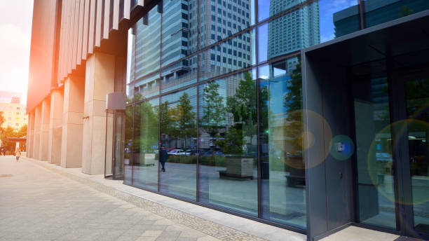 istock Glass windows and sidewalks in office buildings. Sunlight reflecting off large glass panels. 1427096442