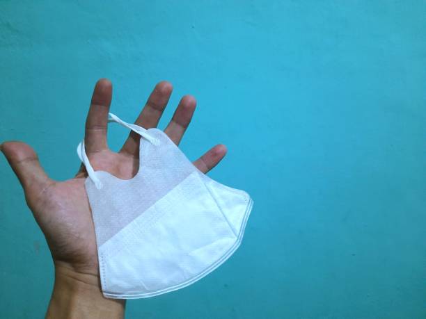 istock a person holding a health mask 1427096756