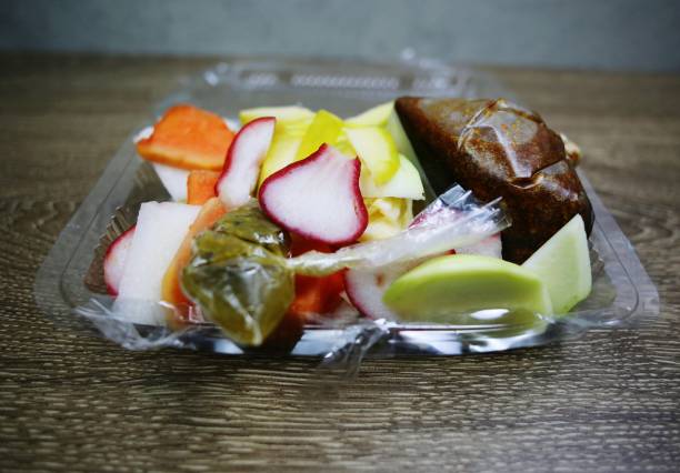 istock Different kind of sliced fruits in plastic container 1427099828
