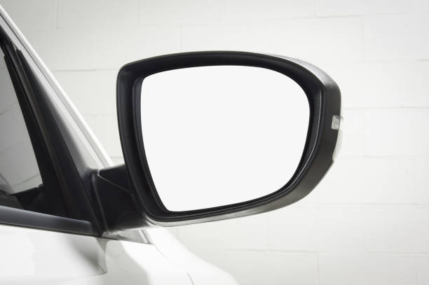 istock Modern White Car Side Mirror Against White Brick Wall Background 1427111735