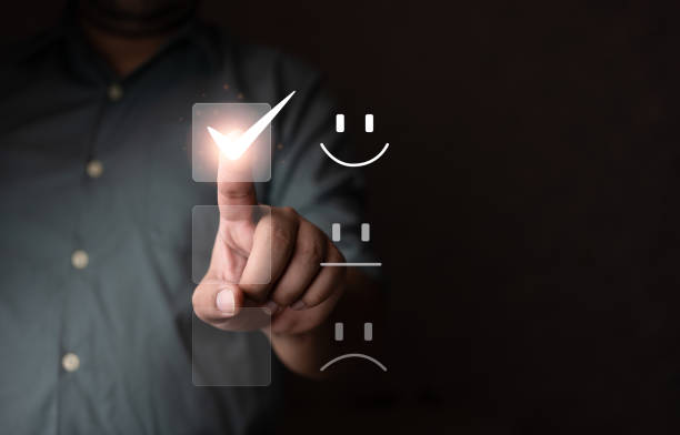 istock Customer service and Satisfaction concept. Customer people are touching the virtual screen on the happy smiley face icon 1427111778
