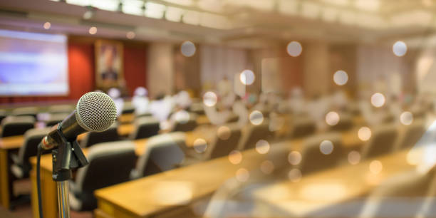 istock Microphone meet lecture over the people forum Meeting Training Learning Coaching 1427114976