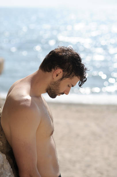 istock Alone sad man profile portrait on a sea beach 1427126991