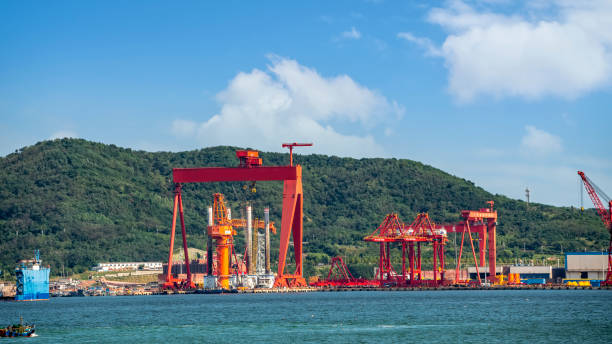 istock Dock cranes loading containers, trade port, shipping 1427127152