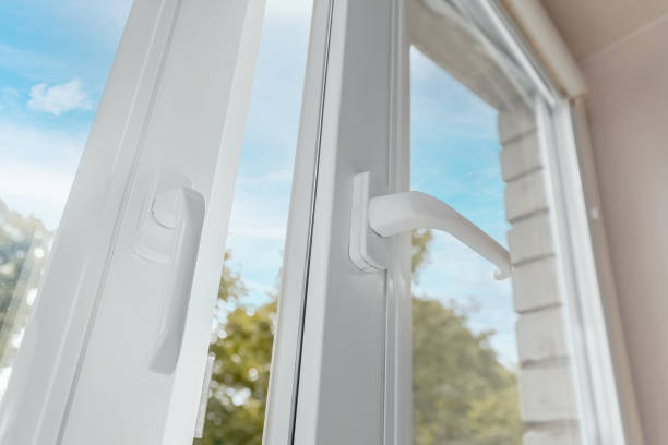 istock Open white metal-plastic modern window in the apartment against the blue sky. 1427128663