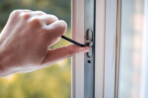 istock adjusting the white plastic window. a worker uses a hexagon to repair a window. 1427128754