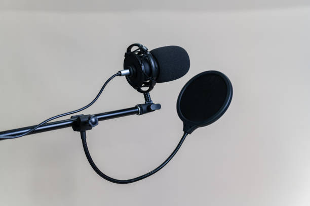 istock microphone in a recording studio. singer microphones on white background 1427130748