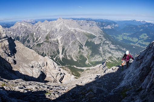 Young woman climbs Mount Watzmann in the alps