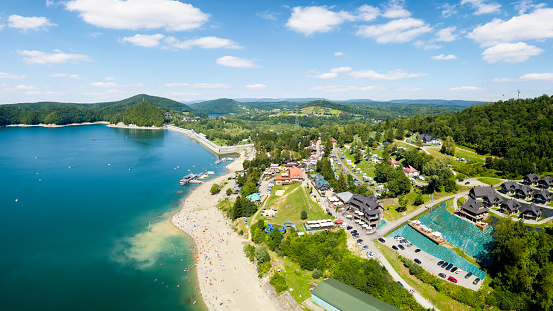 Vacations in Poland - Lake Solina with water dam, Bieszczady Mountains in background
