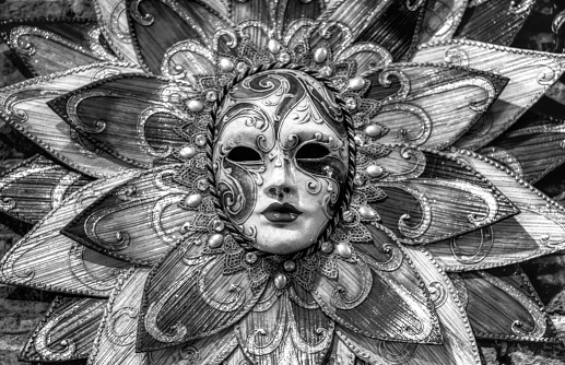 Golden Venetian carnival masks. Vintage masks on a beige background.