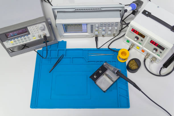istock Power supplies and electronic measuring devices in the laboratory. Top view. 1427136875