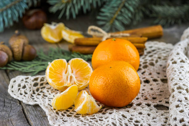 istock Christmas tangerines, cinnamon sticks and  fur-tree branches 1427137312