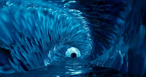 Photo of 3d rendering. Ice cave entrance. frozen tunnel with icy walls of blue ice.